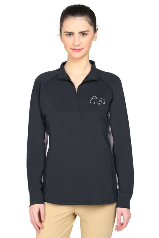 Woman wearing black Tuffrider zippered pullover with horse logo.