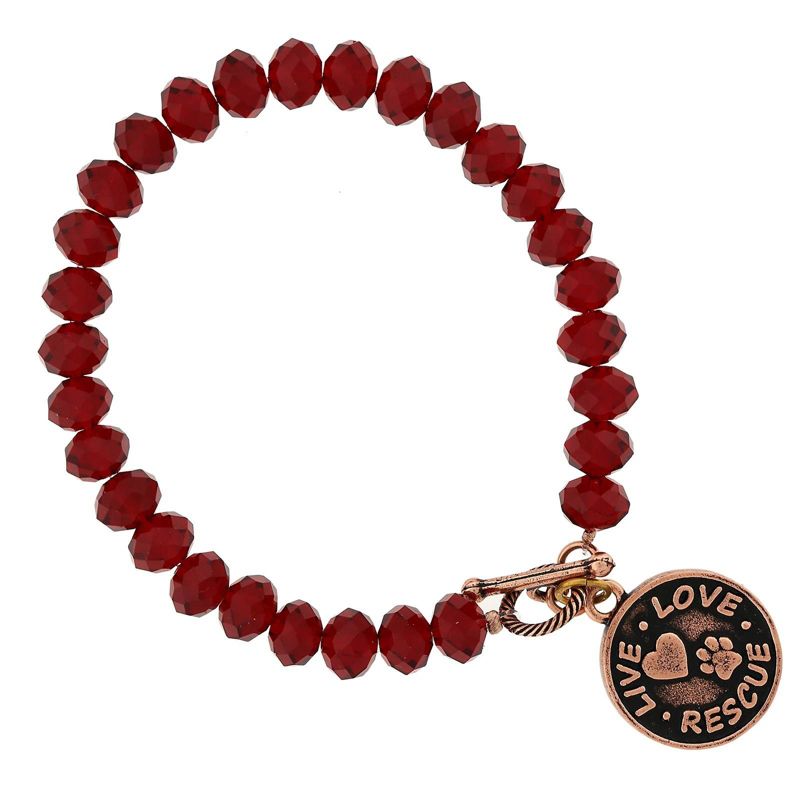 Red beaded bracelet with horse themed jewelry charm and clasp.