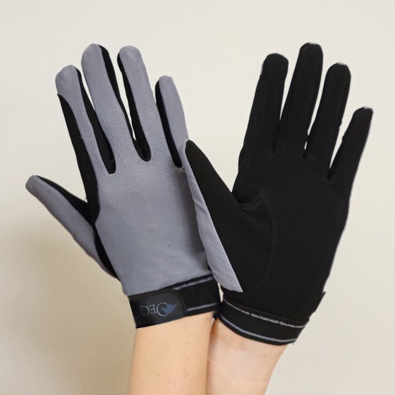 Pair of black and gray gloves displayed on human hands.
