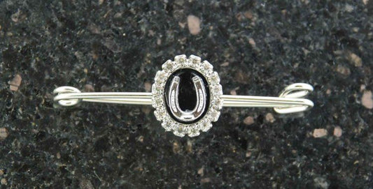 Elegant horse-themed jewelry, silver brooch with black and diamond accents.