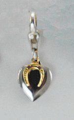 Silver and gold heart-shaped horse-themed jewelry pendant.
