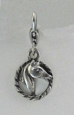 Silver horse-themed jewelry charm with circular braided edge.