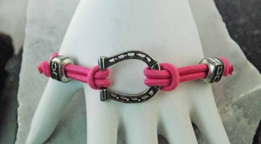 Pink cord bracelet with silver horse bit, horse themed jewelry.