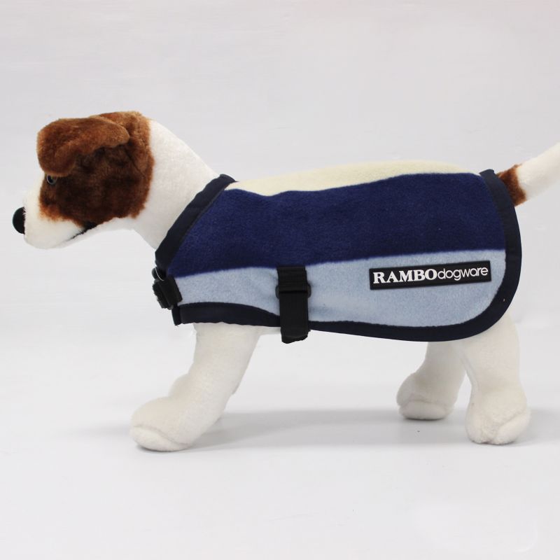 Plush dog model wearing Horseware's RAMBO branded blue dog blanket.